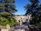 Exciting panoramic landscape of medieval town Besalu with majestic stone arched bridge with towers across the Fluvia river.  Besal