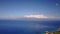 Exciting photography of pacific ocean on the background of blue sky and big mountains mauna loa with active crater of