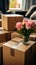 Exciting relocation: Close-up captures couple\\\'s hands clutching moving boxes in new residence.