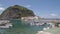 Exciting view of Sant Angelo in Inschia, boats floating on water, nice islet