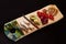 Exclusive painted art cutting board made of wood organic serving dishes with taste food cuisine delicious juicy vegetables red