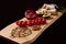 Exclusive painted art cutting board made of wood organic serving dishes with taste food cuisine delicious juicy vegetables red