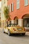 Exclusive vintage car is standing on narrow small streets, replica on the famous convertible car in French Riviera, Cap