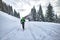 Excursion with mountaineering skis. A man alone in the lane in t