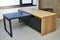 Executive desk of oak veneer with dark grey enamel in office