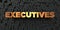 Executives - Gold text on black background - 3D rendered royalty free stock picture