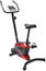 Exercise bike for home or gym, image on white background. Bike black with red inserts, side view.