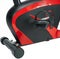 Exercise bike for home or gym, image on white background. Bike black with red inserts, side view.