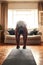 Exercise doesnt drain you, it energizes you. Shot of a young man practising yoga at home during the day.