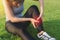 Exercise and healthy concept, Young woman asian have accident leg twist sprain in sport exercise jogging, Selective focus