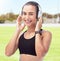 Exercise, podcast and radio with woman listen to music while exercising at a park, happy and relax. Fitness, health and