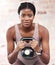 Exercise, workout and black woman with kettle ball for strength, health or wellness. Sports, fitness and face portrait