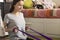 Exercises at home for stretching and strengthening muscles, the girl is engaged with an elastic band