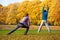 Exercising in colorful autumn park