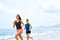 Exercising. Happy Couple Running On Beach. Sports, Fitness. Heal
