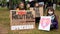 EXETER, DEVON, UK - June 06 2020: A family hold signs at a Black Lives Matter demonstration