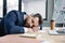 exhausted accountant sleeping near laptop and