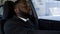 Exhausted of active way of life black man falling asleep in car, tired of work