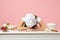 Exhausted chef cook confectioner or baker in white t-shirt, toque chefs hat laid her head down on table sit work at desk