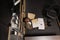 Exhausted cop sitting on floor surrounded by case files