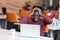 Exhausted entrepreneur working with a computer in his office