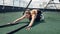 Exhausted fitness woman lying on rooftop