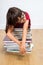 Exhausted intellectual child relaxing, sleeping, leaning on pile of books