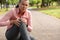 Exhausted jogger woman in the park