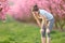 Exhausted runner resting after run in a pink field