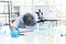 Exhausted scientist sleeping in laboratory. People lifestyles and occupation concept. Science and experiment in lab theme