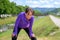 Exhausted woman jogger taking a break