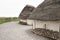 Exhibition neolithic house at Stonehenge, Salisbury, Wiltshire, England with hazel thatched roof and straw hay daubed walls