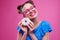 Exhilarated smiling woman with sprinkled donut