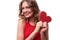 Exhilarated woman holding a valentine greeting card in hands