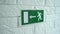 Exit emergency sign in 4K slow motion. An exit sign hangs on a wall. 4k stock footage.