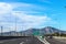 Exit on highway in Greece leaving Athens toward the Peloponnese Peninsula with mountains in the background and signs in Greek and