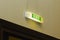 Exit - inscription over the door - green emergency lighting sign