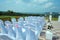 Exit registration of the newlyweds, wedding ceremony under open sky. Seating guests overlooking the river. Rows of chairs