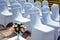 Exit registration of the newlyweds, wedding ceremony under open sky. Seating guests. Rows of chairs with white capes, close up