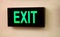 Exit sign, electrically operated glowing cabinet in a public place