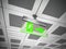 Exit sign hanging on suspended ceiling