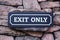 Exit Sign On Stone Wall