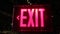 Exit sign tilt dark background