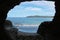 Exit of a tunnel in the rock on the sea shore