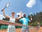 Exited couple is rejoicing at success during tennis match