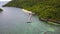 Exotic aerial view of turquoise water with wooden jetty on Flores island Indonesia