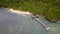 Exotic aerial view of turquoise water with wooden jetty on Flores island Indonesia