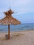 Exotic beach straw umbrella on a beautiful tropical beach