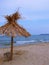 Exotic beach straw umbrella on a beautiful tropical beach