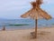 Exotic beach straw umbrella on a beautiful tropical beach